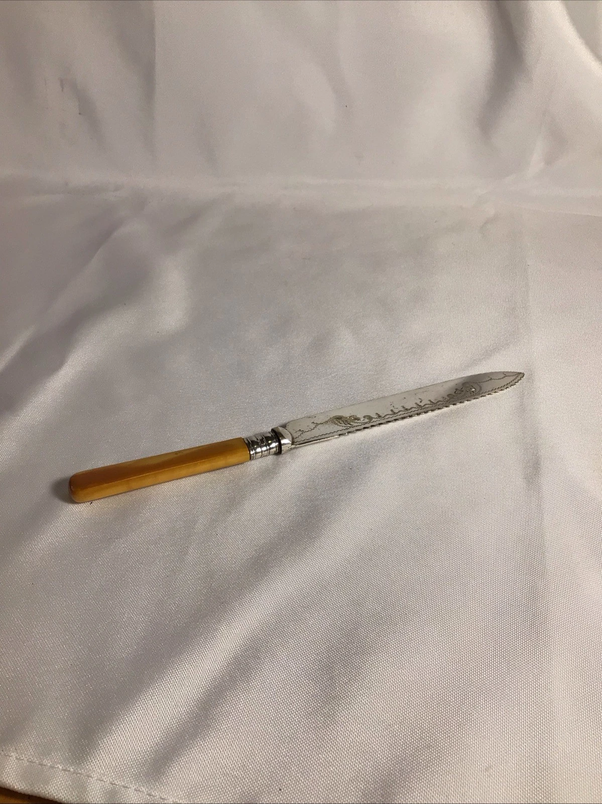 OLD SERRATED BLADE KNIFE WITH ENGRAVING AND HALLMARKS