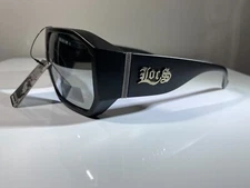 men's hexagonal shaped sunglasses with black frame and gray reflective lenses