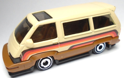 2022 HOT WHEELS '86 TOYOTA TAN & BROWN 1:64 DIECAST 2 5/8'' VAN W/ RED & ORANGE