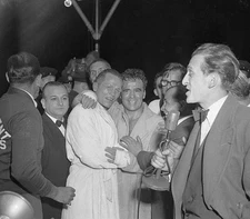 Tony Zale embraces Marcel Cerdan after Cerdan won middleweight cha- Old Photo