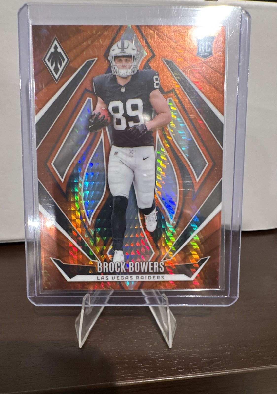 2024 Panini Phoenix - Rookies Brock Bowers #165 Orange Hyper (RC)