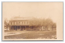 NORTON KANSAS RPPC ~ Early scene BOWERS TAVERN ~ Street view
