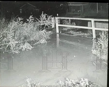 1965 Press Photo Flooded ditch in Englewood, Colorado at wooden bridge.