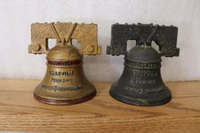 2 versions of Sperry New Holland cast iron Liberty Bell bank circa 1976