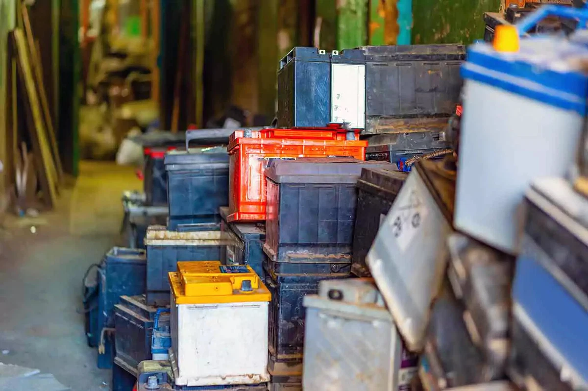 A stack of used vehicle batteries.