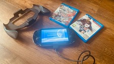 PS VITA with Charger, Handle and x2 Games
