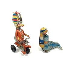 Vintage Tin Wind-Up Toy Duck On Tricycle Seal with Ball / Both Spin Move