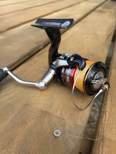 Shimano Sephia BB 3810H Spinning Reel with Orange and Green Gradient Line - 第 1/4 張圖片