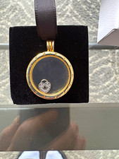 Authentic gold-plated round Pandora floating locket pendant with a small