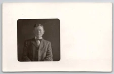 RPPC Young Man with Bow Tie Portrait Real Photo Postcard F22