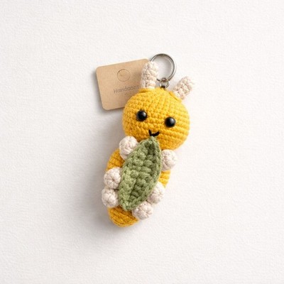 This handmade keychain is carefully crocheted from soft wool yarn and designed i