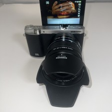 Samsung NX3000, a 20.3MP mirrorless camera with Wi-Fi and a tilt-up display,