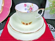 Queen Anne tea cup and saucer lime green trio floral rose inside teacup England 