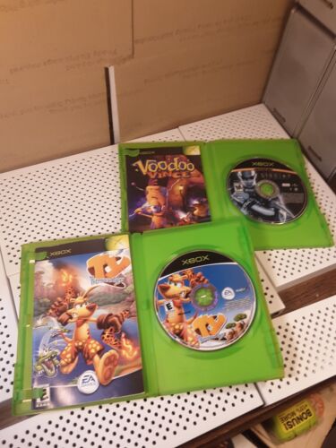 Original Xbox Game Lot Of 2 Case Disc Manual Riddick Ty The Tasmanian Tiger Read - Photo 1 sur 17
