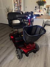 Red 4-Wheeled Electric Mobility Scooter with Padded Seat, Basket, Headlight