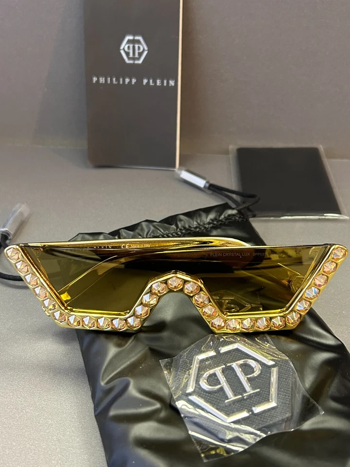 ÓCULOS DE SOL PHILIPP PLEIN SPP031S GLDG CRISTAL LUX FEMININO ESCUDO DOURADO 140mm novo