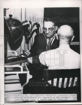 #ad 1951 Press Photo Dr. H.B. Hamilton checks the blood pressure of a trainman $24.99