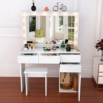 A white dressing table with mirror and stool, lighting and four drawers.