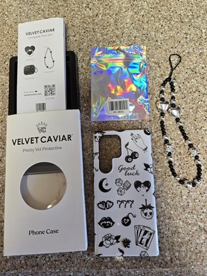 Velvet Caviar ''Good Luck'' Phone Case & Skulls Phone Charm