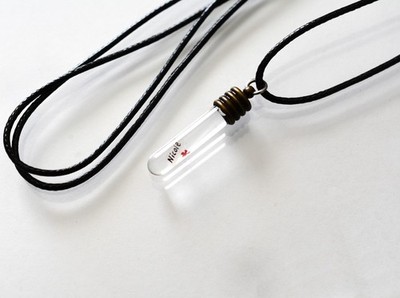 Name on a grain of rice jewelry.  Necklace or keychain. Up to 2 grains of rice.