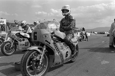 Steve Parrish sits on his Suzuki RG500 on the grid before the star- Old Photo