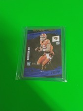 2021 Panini Prestige Xtra Points Blue Rookie Card #201 Trevor Lawrence 244/249. rookie card picture
