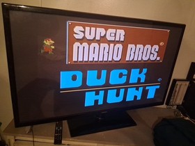 Nintendo NES Juego de Acci&oacute;n Consola Hogar - Gris Dos Mandos Y Super.mario/Pato