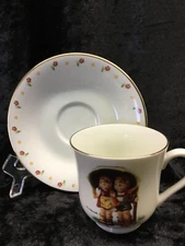M.J. Hummel Tea Cup & Saucer STORMY WEATHER