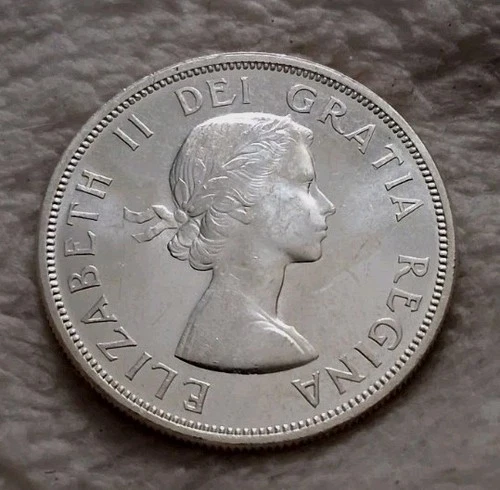 1957 Canadian Silver Dollar 3 Waterlines Variety Brilliant Unc. Trouble Free.