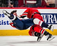 Jalen Chatfield Takes Down Connor McMichael Carolina Hurricanes 8x10 NHL Photo