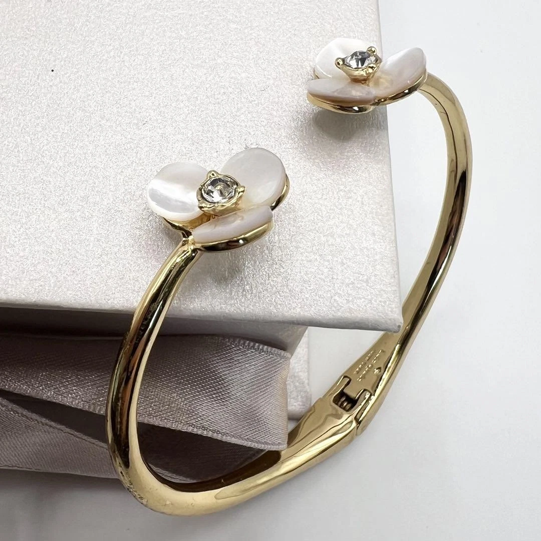 Bracciale Kate Spade bianco farfalla conchiglia fiori