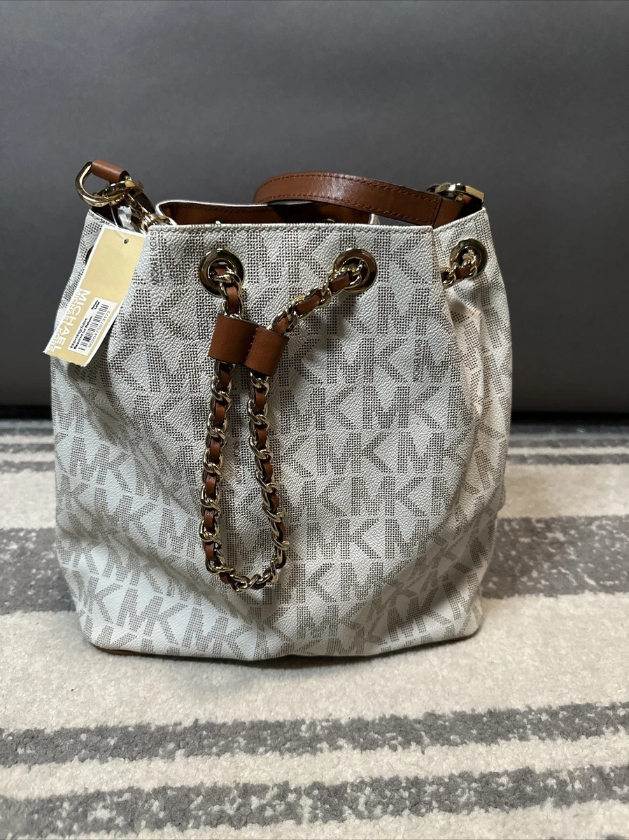 Tan and white michael kors purse 2025
