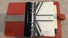 Filofax personal organizer leather. Orange. With some inserts. No calendar .