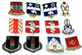 LOT #1: 12 ORIGINAL OCCUPATION 50's GERMAN & JAPANESE MADE US ARMY DI CRESTS