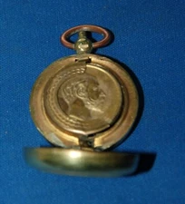 An antique brass sovereign case, King Edward VII internal profile, decorative 