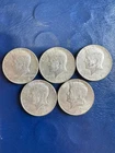 Five 1967 50C Kennedy Half Dollars Au 40 % Silver in excellent condition.