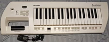 Roland Lucina AX-09 Keytar Synthesizer White 37-Key Keyboard with Power Supply