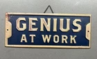 Old VTG Metal Sign Genius At Work Bar Garage Shop Business Home