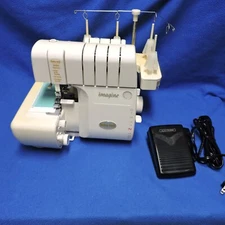 Baby Lock Imagine BLE1AT Serger Machine plus Rolling Trolly Tote Case