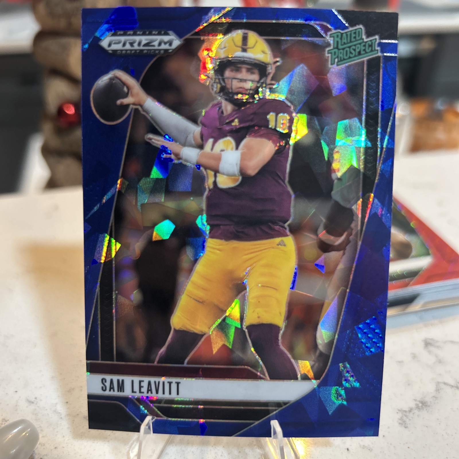 2025 Panini Prizm Draft Picks Sam Leavitt Blue Cracked Ice /149 Rated Prospect