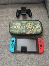 Nintendo switch console with carry case and joy con controller