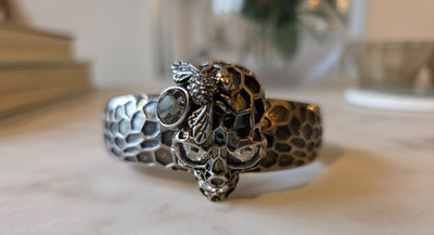 Alexander McQueen silver cuff hinged bracelet skull design with