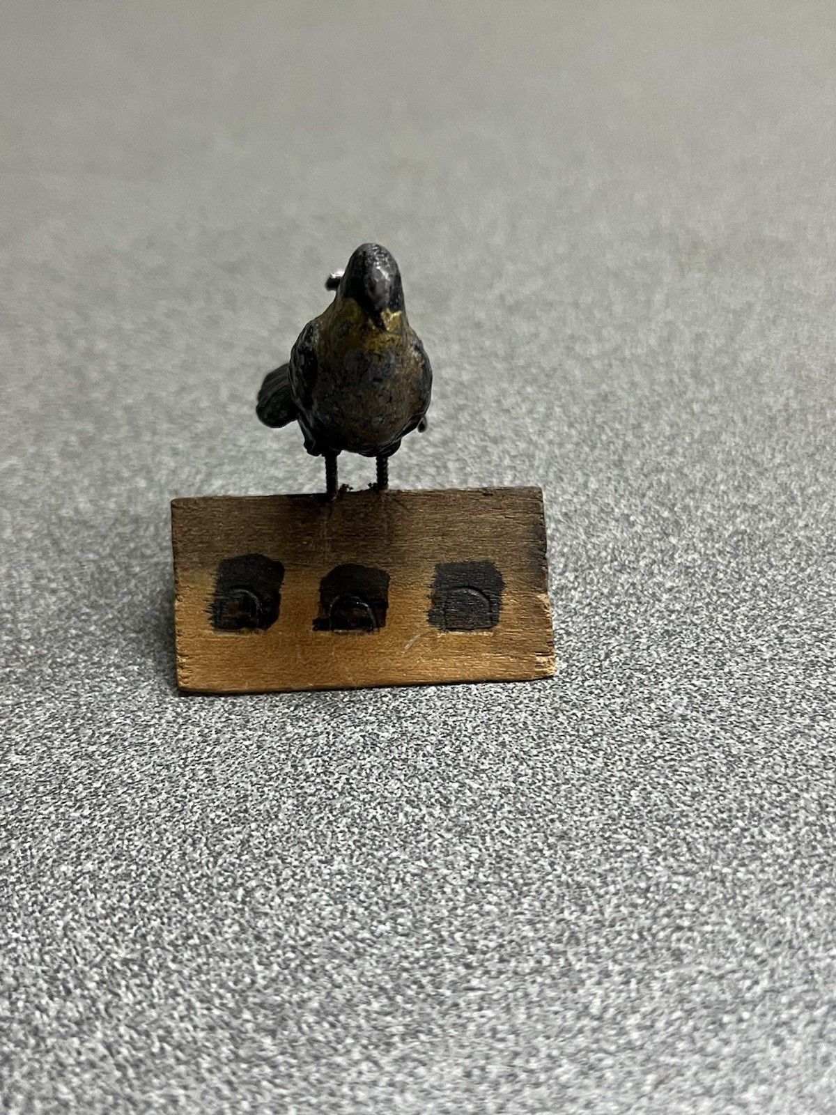 vintage cast metal bird figurine