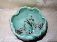 A Beautiful Celadon Bowl that is Hand Painted in a Floral Design