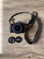 Nikon D3000 Digital SLR Camera With a 18-55mm f/3.5-5.6G AF-S DX Lens