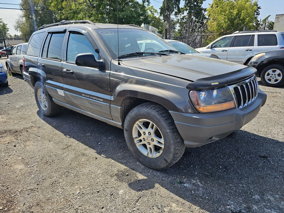 Conjunto de faros izquierdos usados se adapta a: Jeep Grand Cherokee 1999 tinte humo trasero oscuro Foto 2 de 4