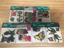 7 PACKAGES IRON - ON APPLIQUES SEVERAL ASSORTED DESIGNS  STYLES 63 PIECES LOT 1