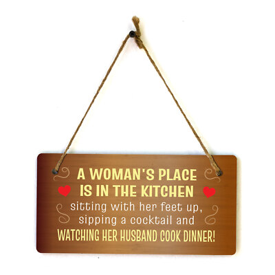 A Woman's Place Is In The Kitchen Sitting With Her Feet Up, Sipping A Cocktail..