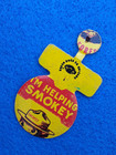 Vintage  I'M HELPING SMOKEY Bear Bend Over Metal TAB BADGE Forest Fires ERROR!! — photo 1