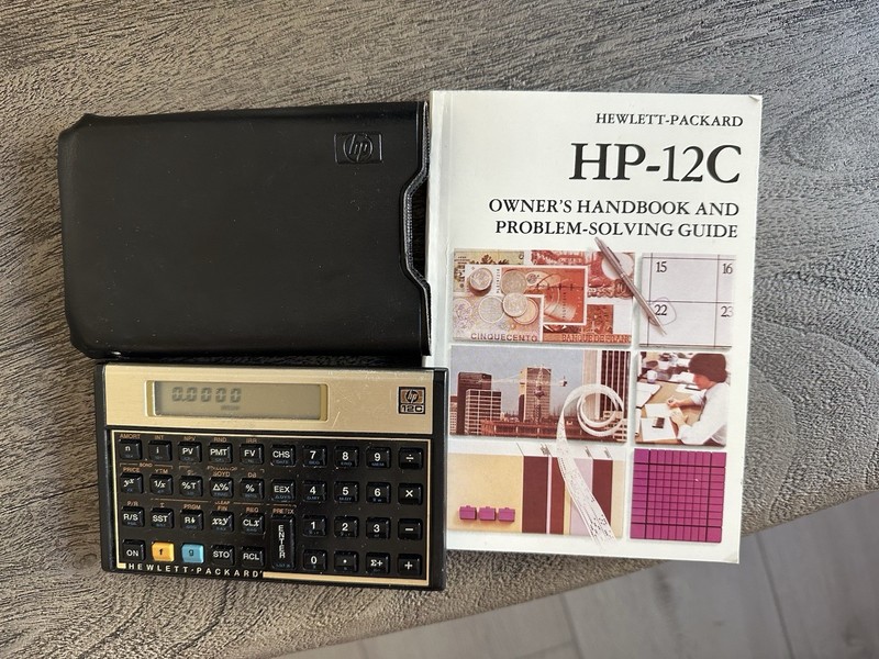 Hewlett Packard HP-12C Calculator, Owners Handbook And Case